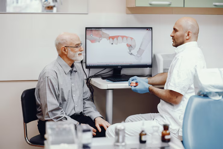 https://lakemagdalenedental.com/wp-content/uploads/2025/06/imgi_12_old-man-sitting-dentist-s-office_1157-19444.png