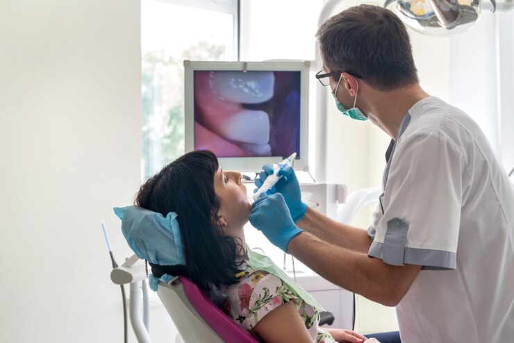 https://lakemagdalenedental.com/wp-content/uploads/2025/06/imgi_15_dentist-checking-patient-s-teeth-with-intraoral-camera_359031-16122.png