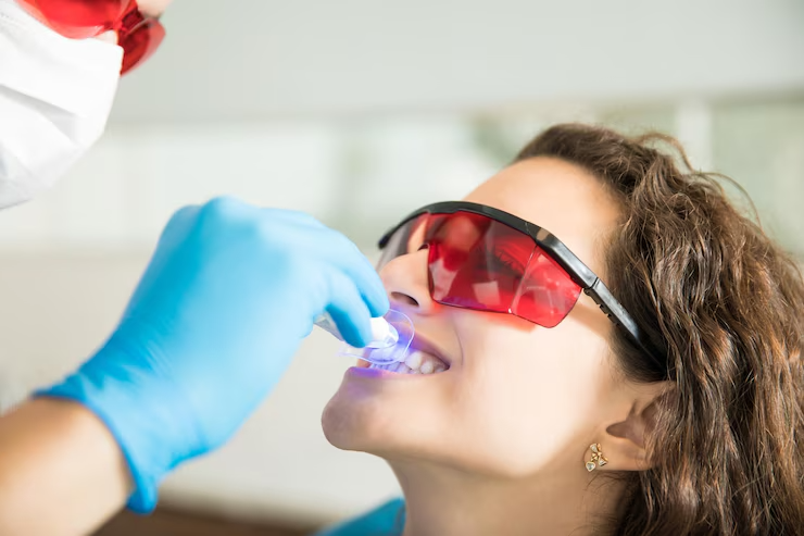 https://lakemagdalenedental.com/wp-content/uploads/2025/06/imgi_3_closeup-young-woman-having-her-teeth-whitened-with-ultraviolet-light-dental-clinic_662251-2598.png