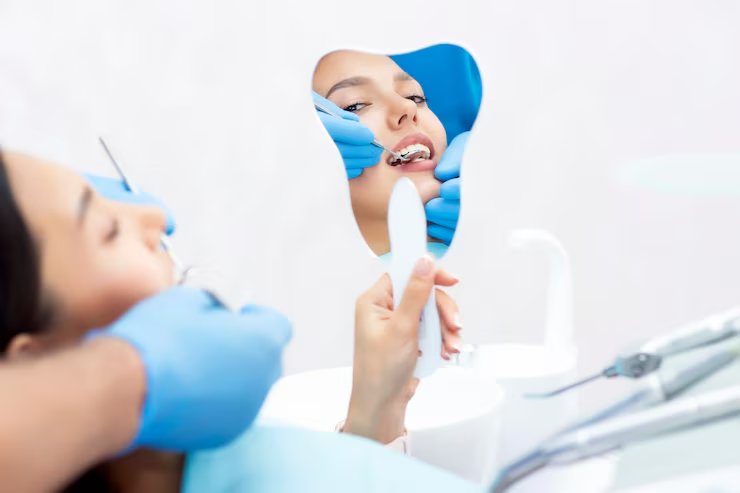 https://lakemagdalenedental.com/wp-content/uploads/2025/06/imgi_8_young-women-checks-her-teeth-mirror-new-dental-implants_170532-1647.png