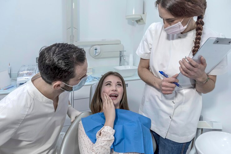 https://lakemagdalenedental.com/wp-content/uploads/2025/06/side-view-female-doctor-examining-patient_1048944-21807758-1.jpg